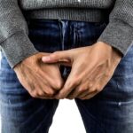 testicles, testicular cancer, cancer of the penis, pains, venereal diseases, man, pool, jeans, hands