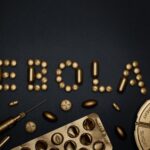 Creative arrangement of pills spelling 'EBOLA', showcasing a conceptual healthcare theme.