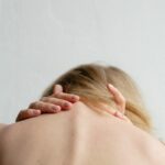 woman covering her breast with her hand